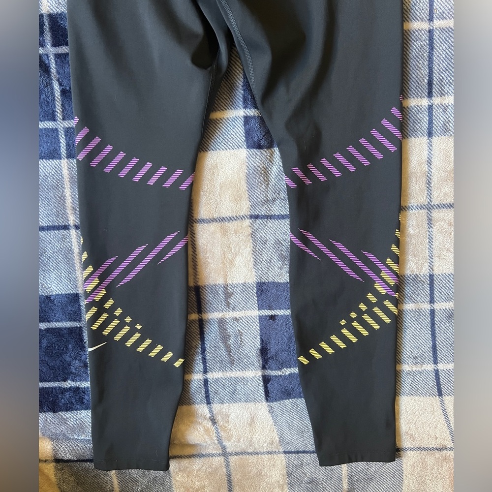Nike Black Leggings with Purple and Yellow Diagonal Stripe Accents - Picture 8 of 10